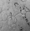 NASA’s New Horizons finds frozen plains in Pluto’s ‘heart-shaped’ feature