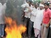 Government introduces Lokpal Bill; Hazare’s supporters burn copies