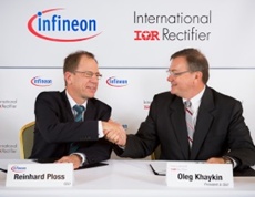 Dr. Reinhard Ploss (L), CEO, Infineon Technologies AG and Oleg Khaykin, President and CEO of International Rectifier