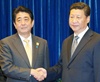 Japan's Abe, China's Xi meet raising hopes of a thaw in tensions
