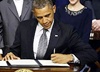 Obama signs bill to give Congress powers over Iran nuclear deal