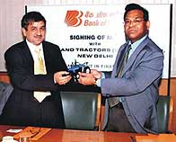 B.G.Baria (R), General Manager (Agri, PS and RRB''s), Bank of Baroda; Rakesh Malhotra (L), Director Finance M/s New Holland Tractor (India) Pvt.Ltd. at the signing of MOU